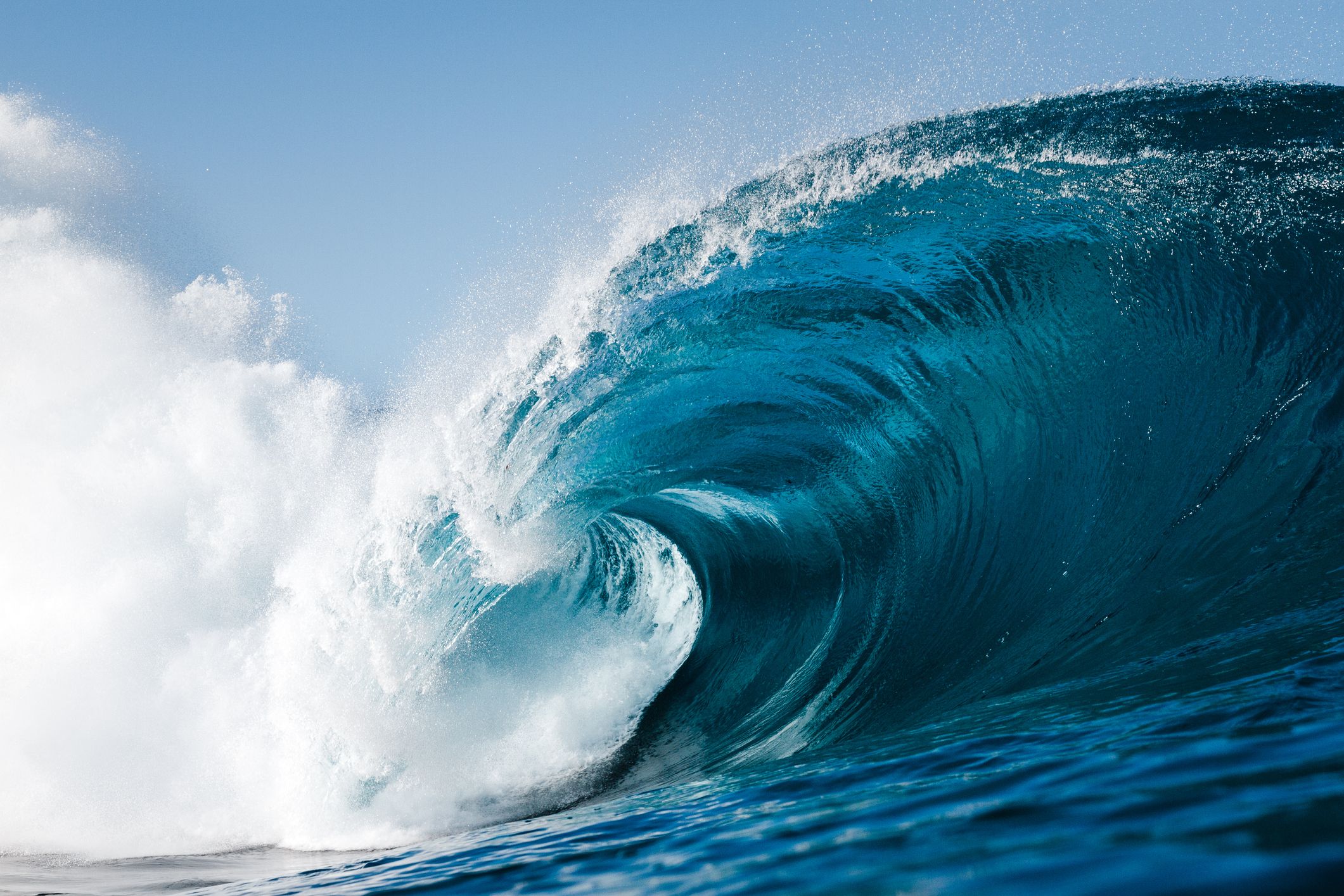 A rolling wave in a blue ocean